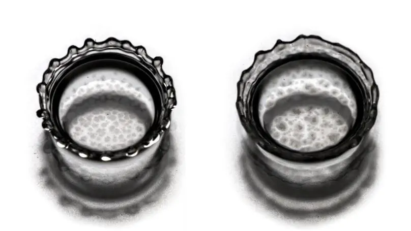 Crystal growth at a liquid-liquid interface upon drop impact