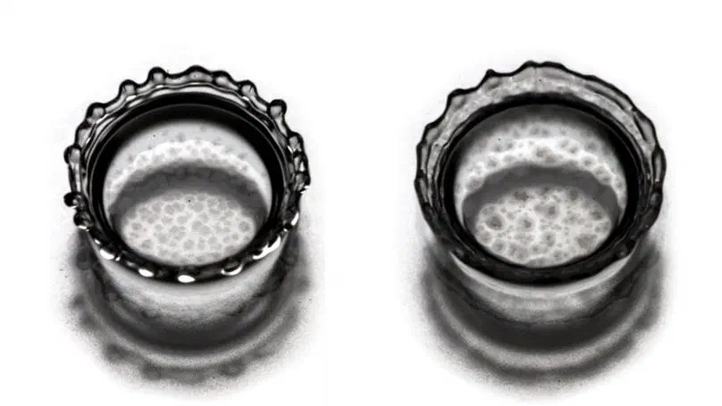 Crystal growth at a liquid-liquid interface upon drop impact