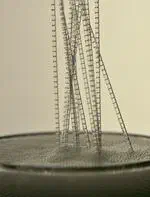 Dynamics of bubbles spontaneously entering in a tube